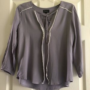 Grey blouse with white dot trim